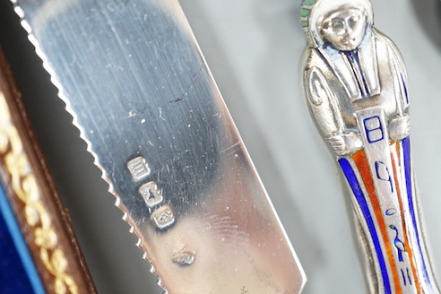 A cased set of six silver teaspoons, a silver bread knife, two 925 pill boxes, an 800 and enamel 'Tutankhamun' pencil case and a silver condiment spoon.